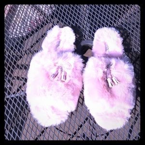 Pretty in Pink! Swanky fun, furry Coach slippers.